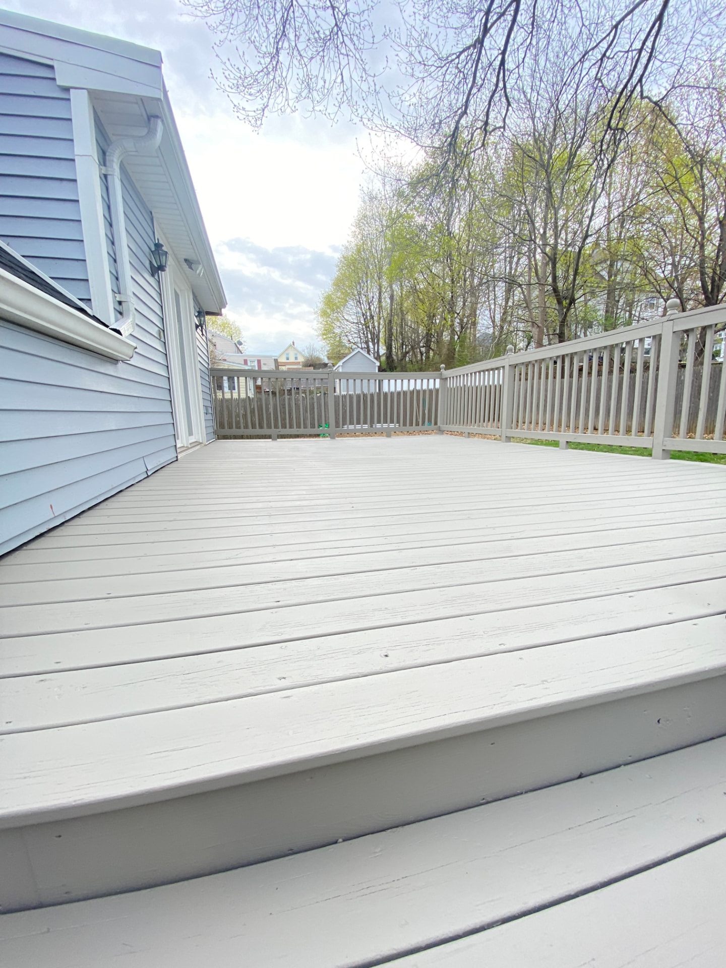 After: the same Braintree deck refinished with an even, protected finish